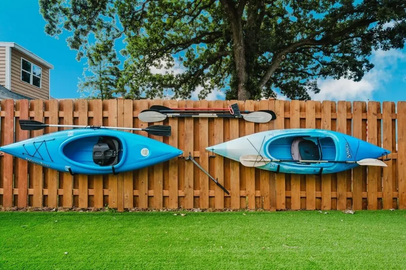 Kayaks along the fence