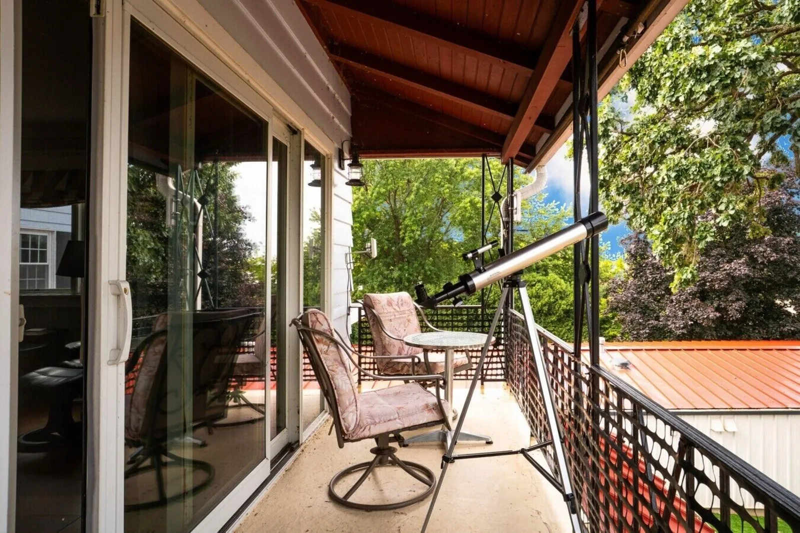 The covered porch overlooking the water